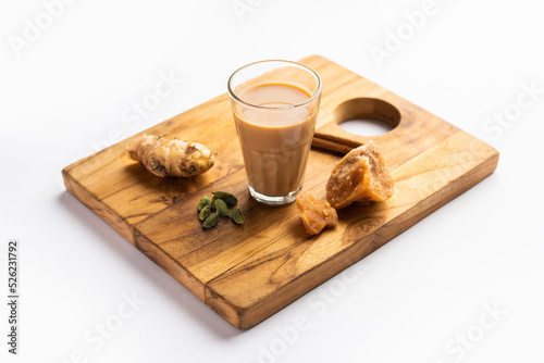 Jaggery tea or Gur ki chai with ingredients like gud, ginger or adrak, green cardamom and cinnamon photo