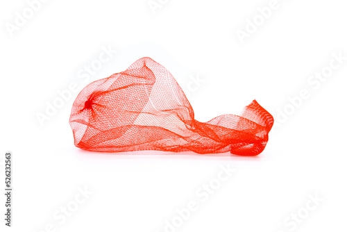 Closeup of red plastic mesh bag isolated on white background