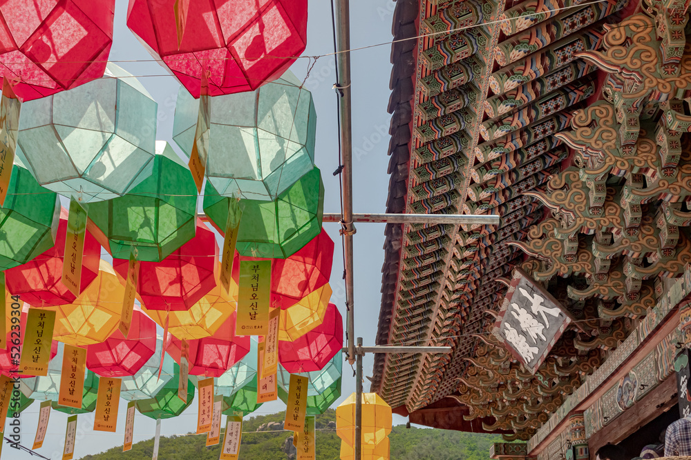 Naklejka premium Colorful lanterns and traditional architecture at the Beomeosa Buddhist temple in Busan South Korea during Buddha's birthday festival