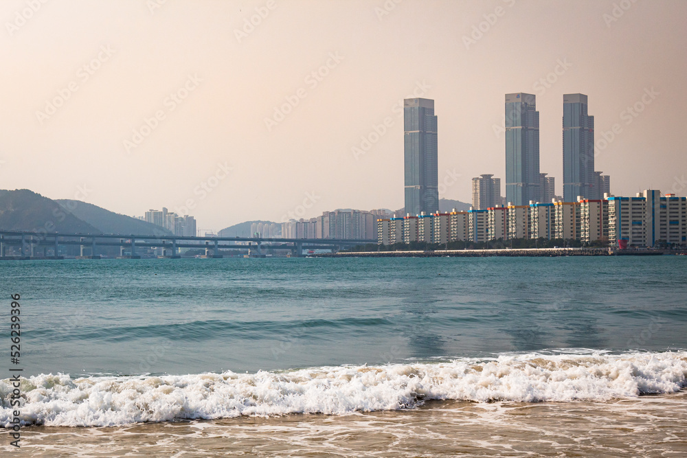 Naklejka premium Tall buildings along the beach and shoreline in Busan South Korea