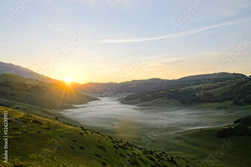 Fog Filled Valley in the Mountains of Italy at Sunrise