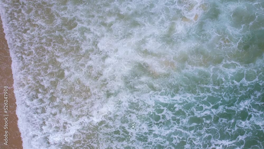 Top view tropical beach Amazing waves sea background. Crashing waves on beach sand, Beautiful sea background