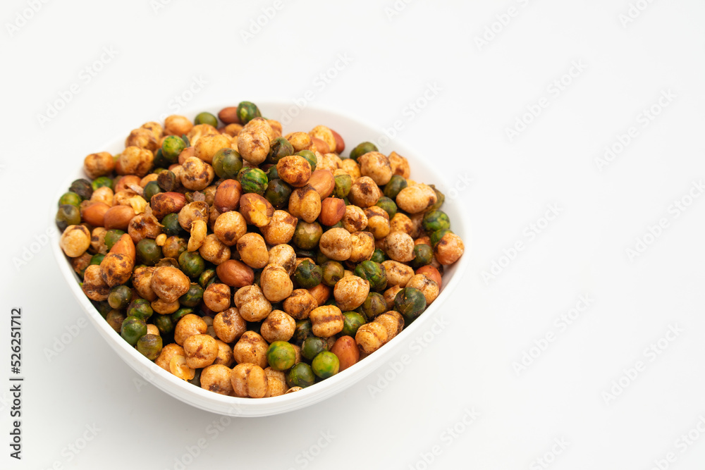 Cocktail Mix Namkeen Mixture Also Called Tedhe Medhe Chakhna Made Of Mixed Nuts Like Kabuli Chana Mungfali Hara Matar Kabli Channa And Moongfali Badam. Isolated On White Background With Copy Space Cocktail Mix Namkeen Mixture Also Called Tedhe Medhe Chakhna Made Of Mixed Nuts Like Kabuli Chana Mungfali Hara Matar Kabli Channa And Moongfali Badam. Isolated On White Background With Copy Space