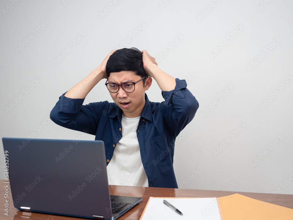 Businessman feels headache about working at workplace table Businessman feels headache about working at workplace table