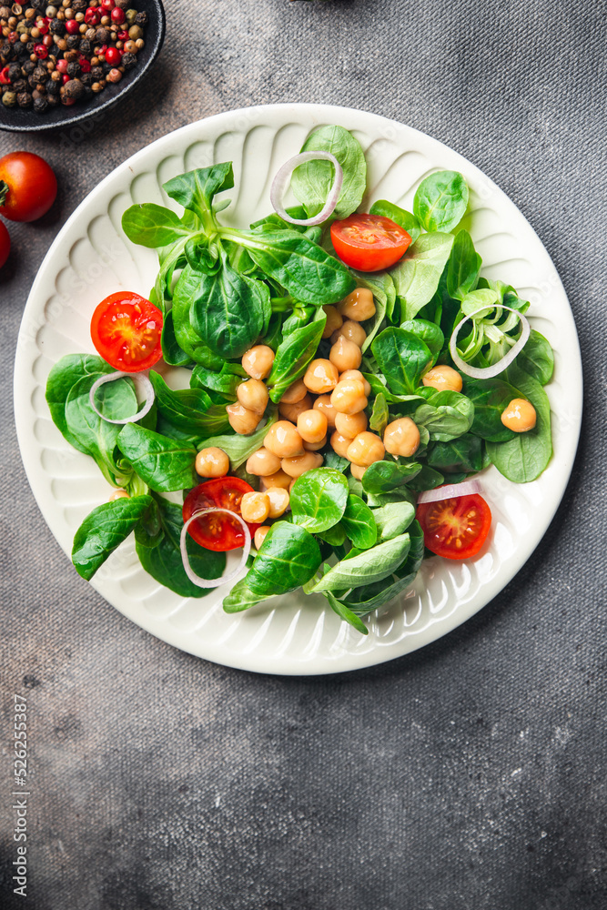 vegetable salad chickpea, legume, lettuce, mache, tomato fresh healthy meal food snack diet on the table copy space food background vegetable salad chickpea, legume, lettuce, mache, tomato fresh healthy meal food snack diet on the table copy space food background