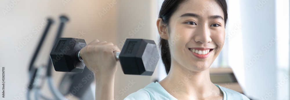 Beautiful and shapely Asian woman working out in the gym, Play exercise machine treadmill, Dumbbell, stretching, Hanging bar, Barbell, Cardio, Stretch, Woman warming up in the gym, Jump rope. Beautiful and shapely Asian woman working out in the gym, Play exercise machine treadmill, Dumbbell, stretching, Hanging bar, Barbell, Cardio, Stretch, Woman warming up in the gym, Jump rope.