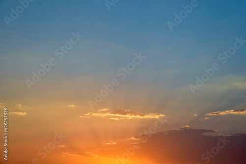 Magnificent bright colorful sky at sunset, nature landscape. Sun's rays break through clouds. Copy space. Soft focus.