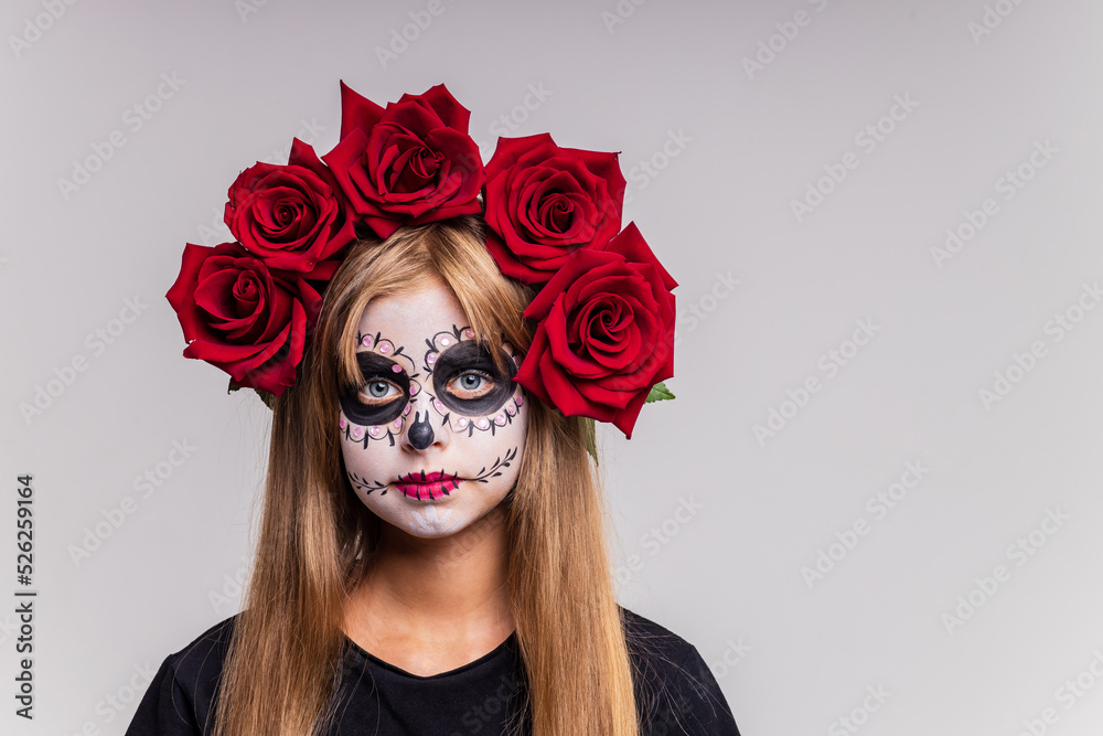girl with painted face looking at camera in studio and ready to party
