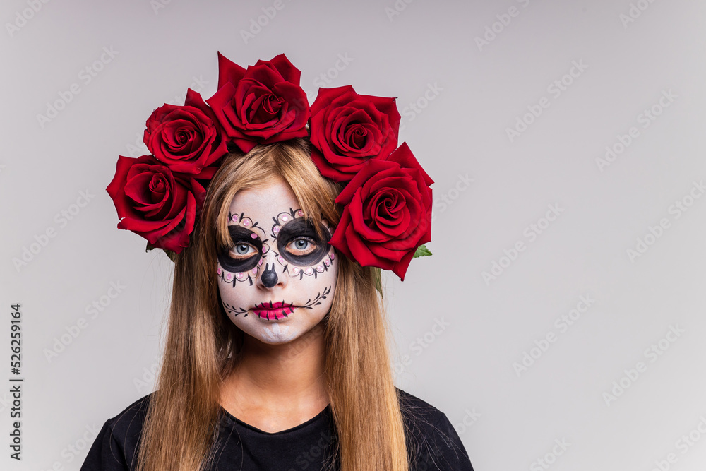 girl with painted face looking at camera in studio and ready to party girl with painted face looking at camera in studio and ready to party