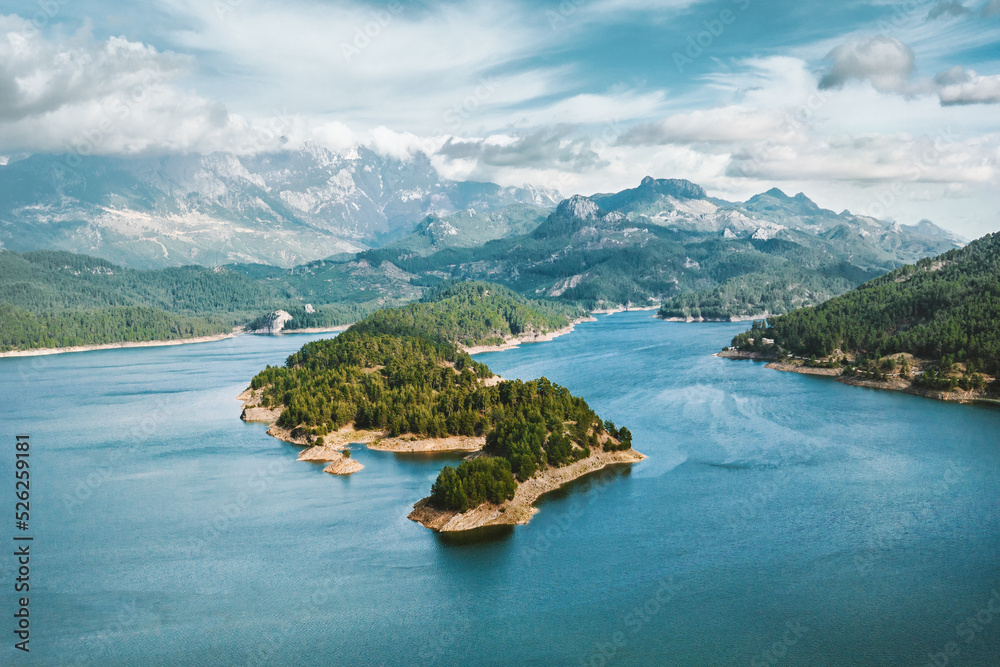 Karacaoren lake and mountains aerial view landscape in Turkey. Forest island in turquoise water scenery wild nature travel beautiful destinations Karacaoren lake and mountains aerial view landscape in Turkey. Forest island in turquoise water scenery wild nature travel beautiful destinations