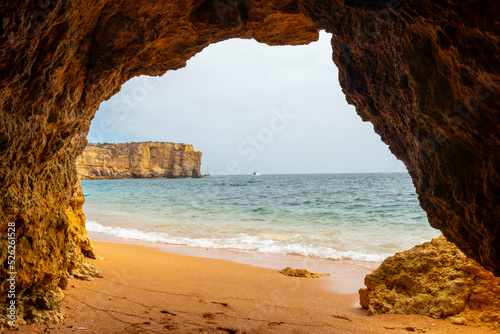 Natural cave in the Algarve in summer on the beach at Praia da Coelha, Albufeira. Portugal © unai