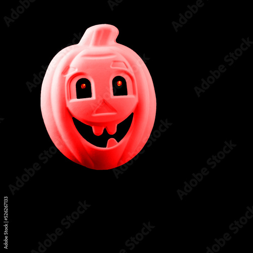 Halloween.  Pumpkin cut in the shape of a ghoston a black background, Halloween concept. photo