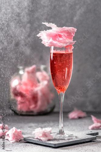 Pink cocktail with pink cotton candy