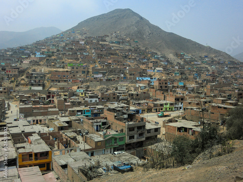 The city of Collique on the side of a mountain, north of Lima, the capital of Peru. photo