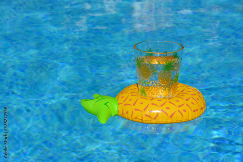 Drinks holder floating in pool with copy space