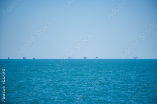Commercial cargo vessels waiting to enter the port