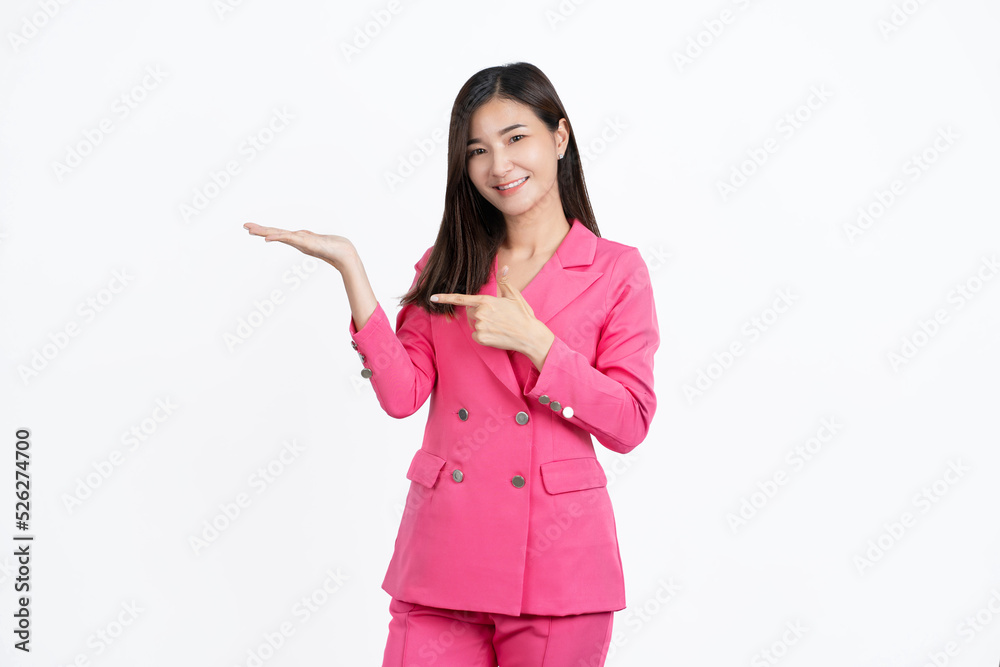 Happy young Asian woman presenting or showing open hand palm with copy space for product isolated on white background Happy young Asian woman presenting or showing open hand palm with copy space for product isolated on white background