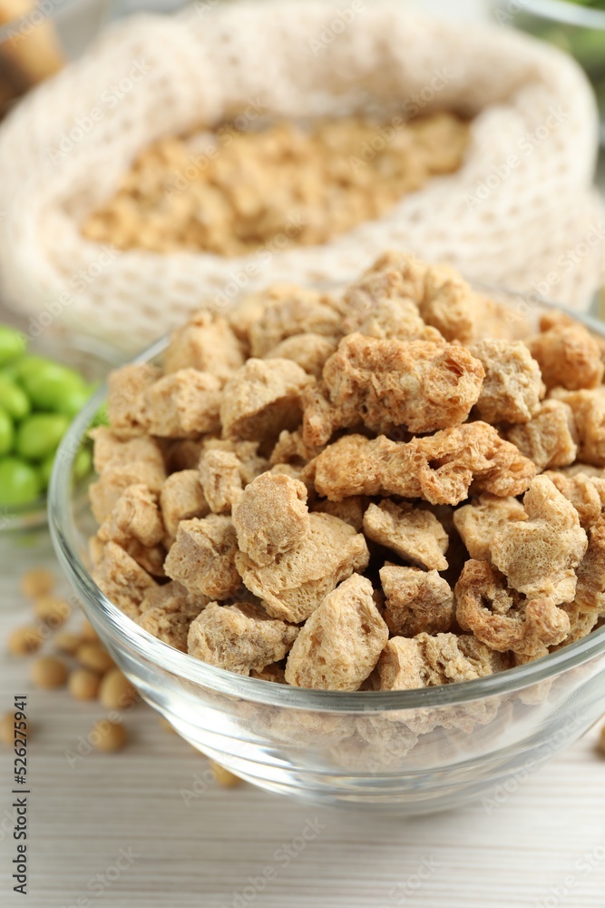 Dehydrated soy meat and other organic products on white wooden table, closeup Dehydrated soy meat and other organic products on white wooden table, closeup