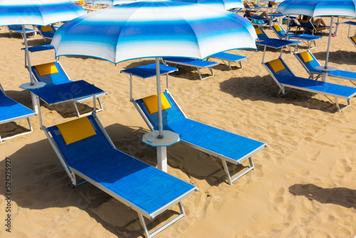 Fototapeta Naklejka Na Ścianę i Meble -  Traditional beach chair and umbrella. Rimini, Italy,