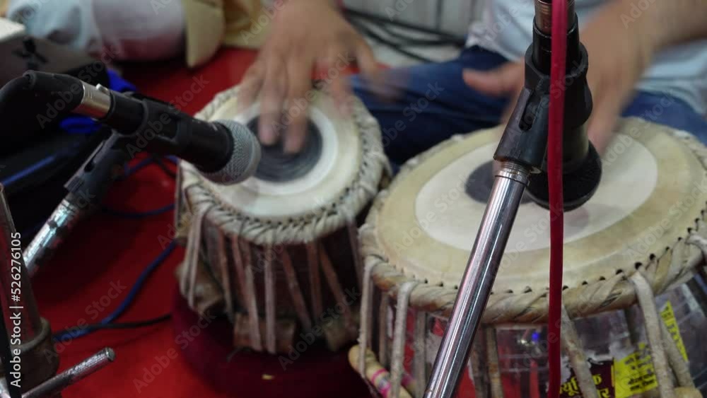 Tirupati, India 16th August 2022: Indian musicians and devotees soulfully singing bhajans and chants. Offerings to Hindu gods and Godesses. Popular music instruments used during bhakti and satsangs.