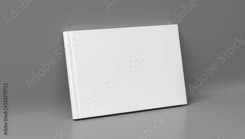 Blank horizontal hardcover book cover mockup standing on gray background © dimamoroz