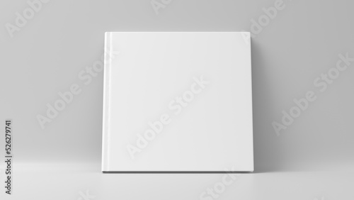 Blank square hardcover book cover mockup standing on white background © dimamoroz