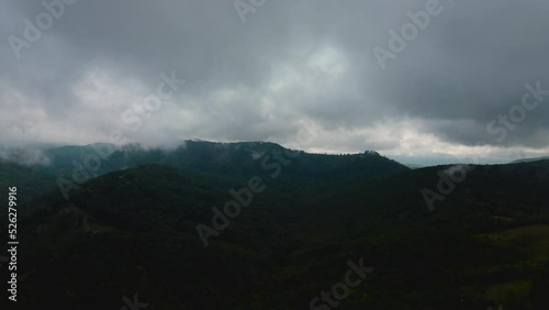 Aerial time lapse of fog over hills, after rain