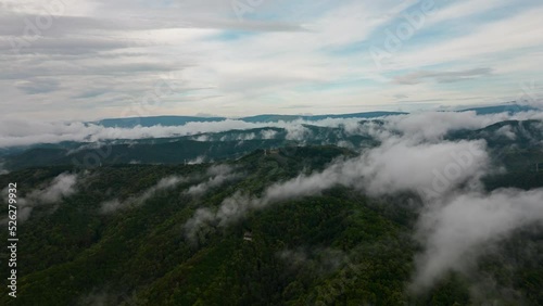 Aerial time lapse of fog over hills, after rain