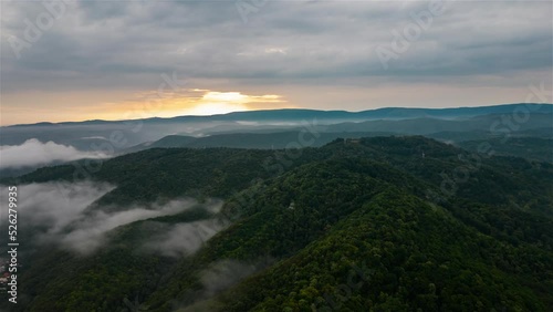 Aerial time lapse of fog over hills, after rain