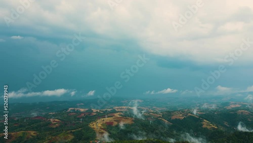 Aerial time lapse of fog over hills, after rain