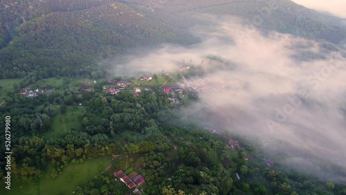 Aerial time lapse of fog over hills, after rain