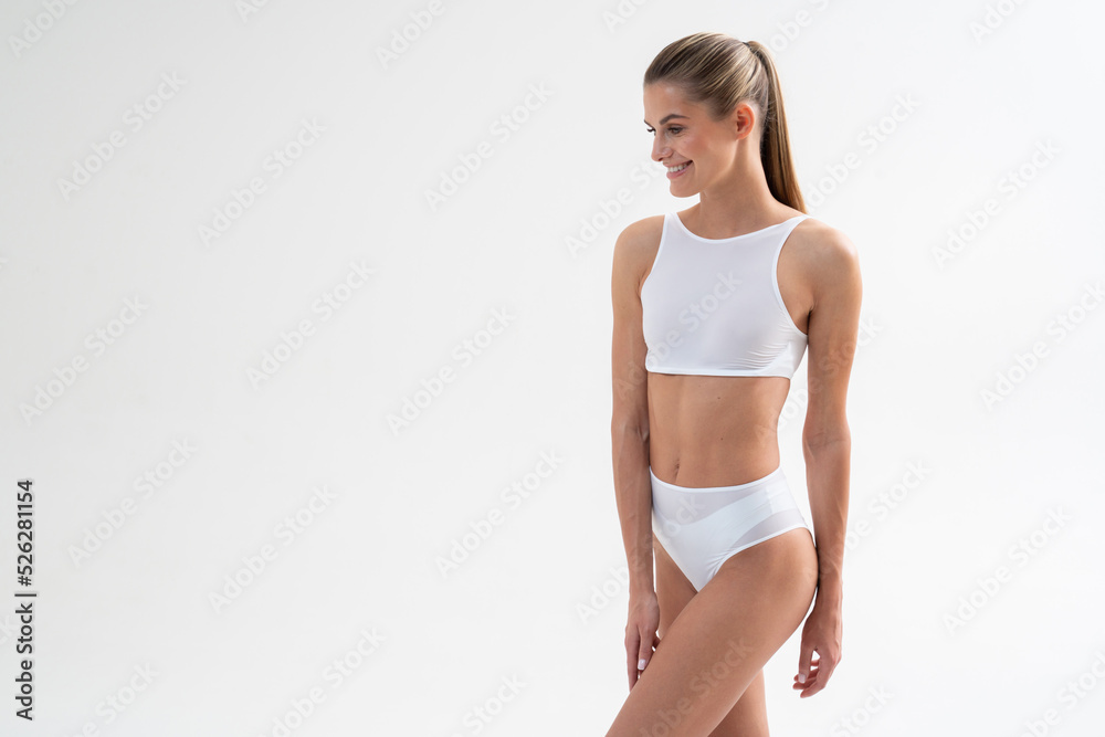 Athletic woman fitness coach on white copy space background Athletic woman fitness coach on white copy space background
