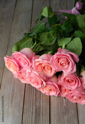 Roses on wooden board, Valentines Day background, wedding day © Marina