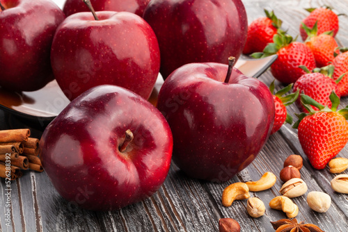 red delicious apple on wood background