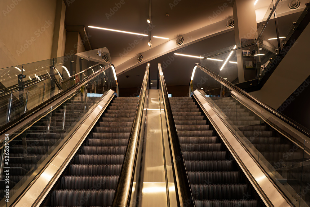 Escalators and stairs accessing a modern building. Escalators and stairs accessing a modern building.
