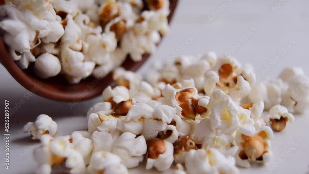Popcorn In Bowl Spilled On The Table Closeup Shot Popcorn In Bowl Spilled On The Table Closeup Shot