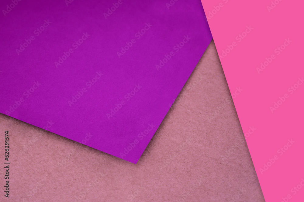 Plain and Textured pink purple brown papers randomly laying to form M like pattern and triangle for creative cover design idea Plain and Textured pink purple brown papers randomly laying to form M like pattern and triangle for creative cover design idea