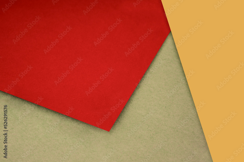 Plain and Textured mustard yellow brown red papers randomly laying to form M like pattern and triangle for creative cover design idea Plain and Textured mustard yellow brown red papers randomly laying to form M like pattern and triangle for creative cover design idea