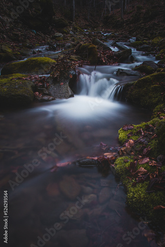 Frosty waterfall Tosanovsky in autumn colours in a beautiful unforgiving part of the Beskydy Mountains in eastern Czech republic, central Europe photo