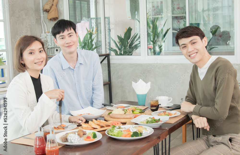 Young smart partnership celebration having dinner in restaurant, Asian friends LGBTQ spent time together talk or meeting in cafe, happy staff workers having lunch with western food and wine Young smart partnership celebration having dinner in restaurant, Asian friends LGBTQ spent time together talk or meeting in cafe, happy staff workers having lunch with western food and wine