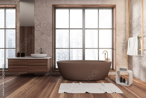 Front view on bright bathroom interior with bathtub  panoramic window