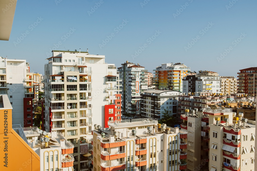 City modern high-rise apartment buildings on sky background City modern high-rise apartment buildings on sky background