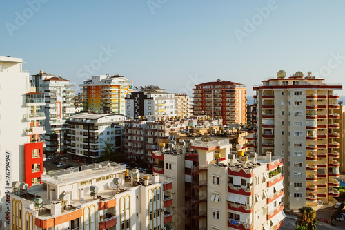 City modern high-rise apartment buildings on sky background