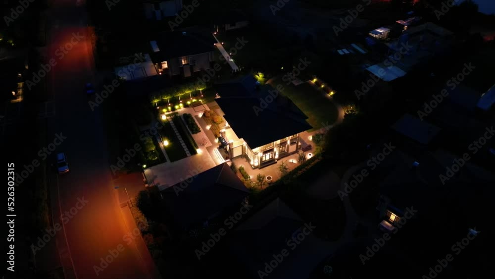 Night illumination of a country house from a drone