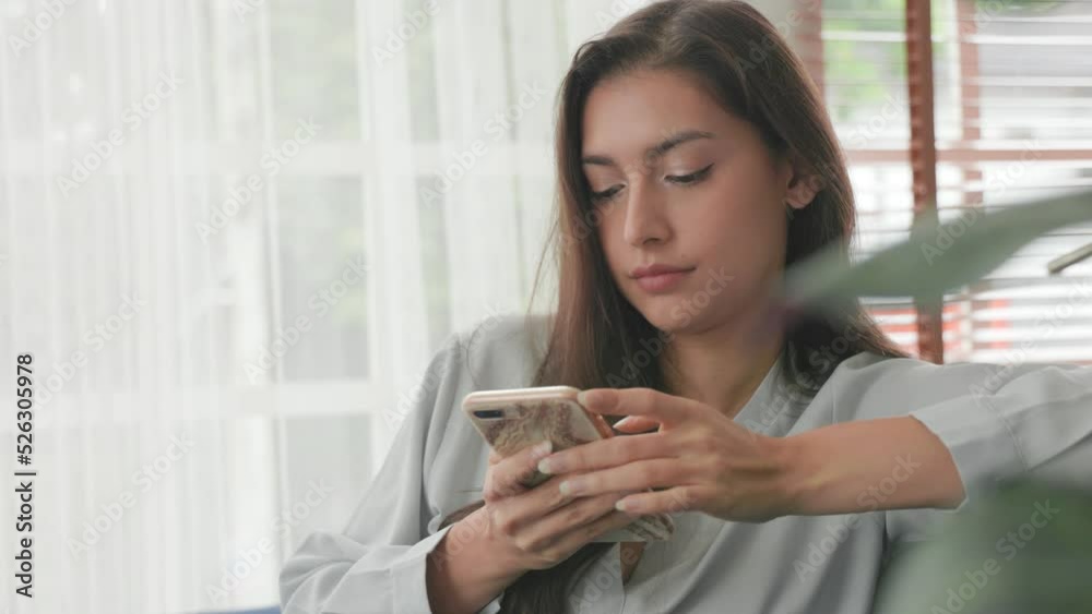 Happy relaxed woman spending time at home with cell gadget technology Happy relaxed woman spending time at home with cell gadget technology