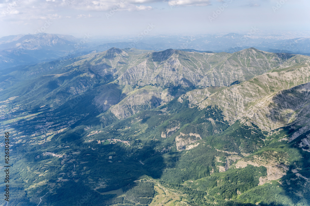 Gorzano peak barren slopes on green Tronto valley aerial , Italy