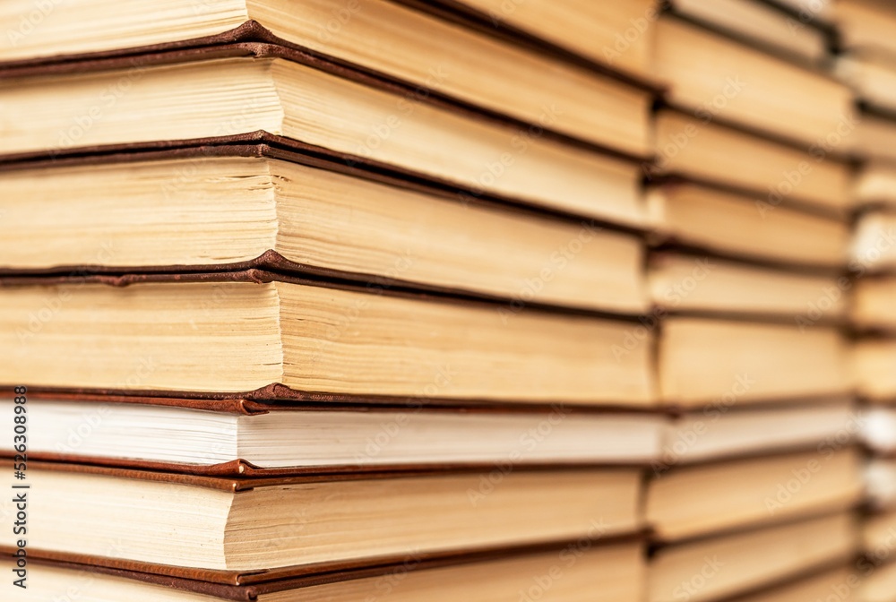 Used books stacks background. Literature in library, bookstore. Novels, memoires, bibliographies, cookbooks, bestsellers. Used books stacks background. Literature in library, bookstore. Novels, memoires, bibliographies, cookbooks, bestsellers.