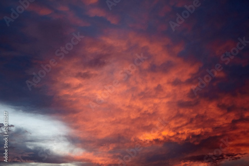 Beautiful sunset sky with clouds. Amazing summer sunset background © mikeosphoto