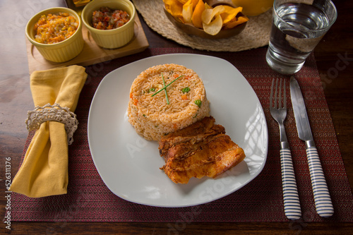 Fried Vegetable rice with fried pork chop peru peruvian gourmet restaurant popular comfort food