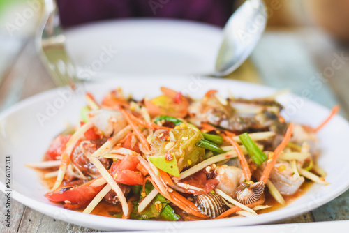 Close-up of Asian woman eating papaya salad